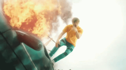 Man Standing Above Car Explosion GIF