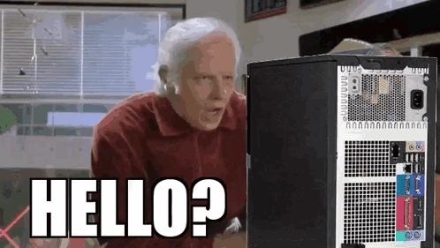 Man Standing at Computer Says Hello?