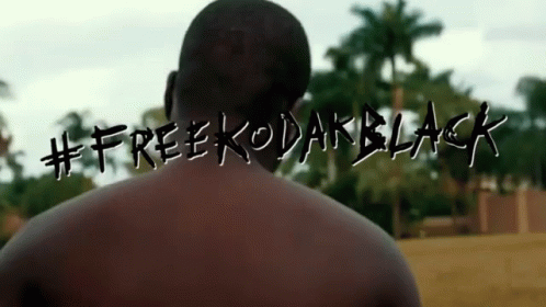 Man Standing Before #free kodakblack Sign