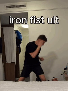 Man Standing Before Iron Fist Ult Wall