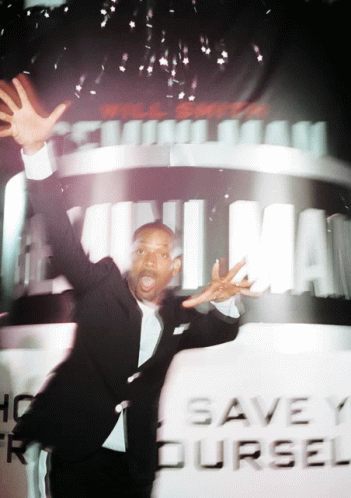 Man Standing Before Save Yourself Sign