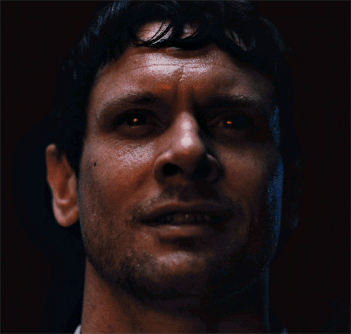 Man Standing Before Skull Crowd