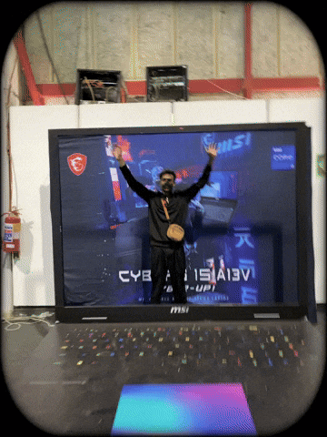 Man Standing By Large MSI Laptop GIF