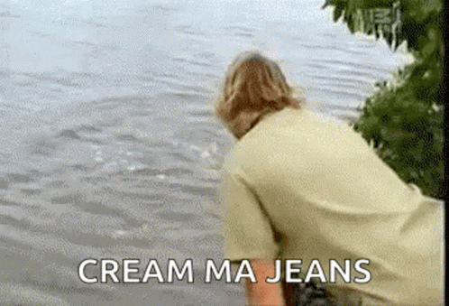 Man Standing by Water Saying Cream Ma Jeans