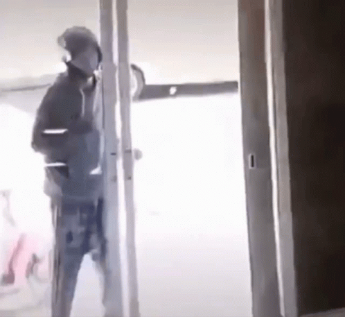 Man Standing In Doorway GIF
