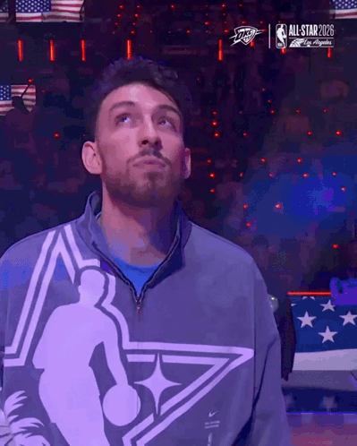 Man Standing in Front of All Star 2028 Screen