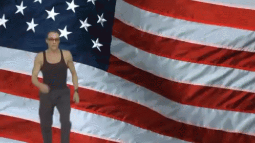 Man Standing in Front of American Flag