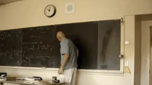 Man Standing In Front Of Blackboard GIF