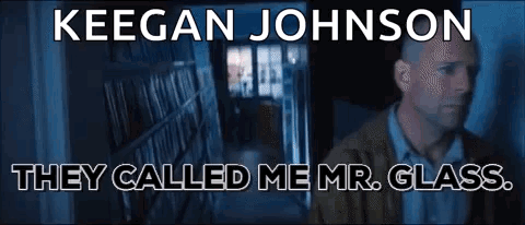 Man Standing in Front of Bookshelf Saying Mr. Glass