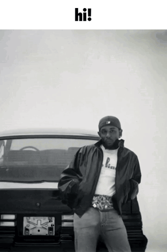 Man Standing in Front of Car Saying Hi