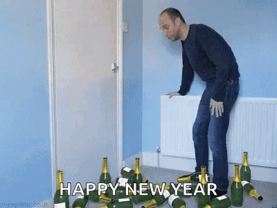 Man Standing in Front of Champagne Bottles