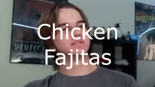 Man Standing in Front of Chicken Fajitas Sign