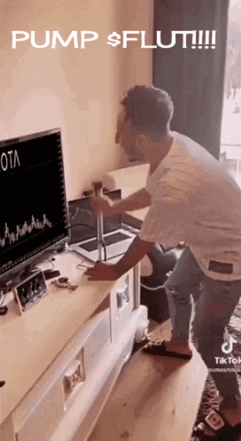 Man Standing In Front Of Computer Screen Saying Pump $ Fluti GIF