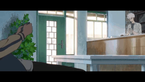 Man Standing in Front of Counter With Green Door