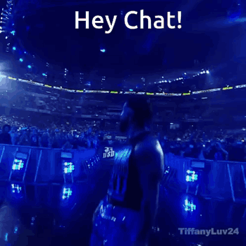 Man Standing in Front of Crowd Saying Hey Chat