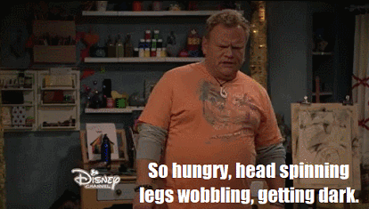 Man Standing in Front of Disney Channel Sign