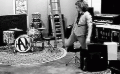Man Standing In Front Of Drum Set With N GIF