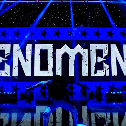 Man Standing In Front Of Endomen Sign GIF