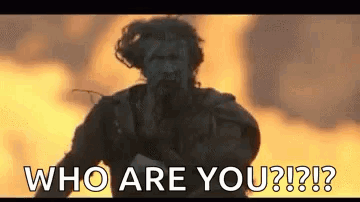 Man Standing In Front Of Fire Saying Who Are You GIF