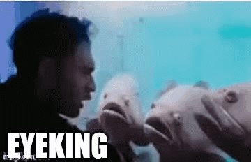 Man Standing in Front of Fish Saying Eyeking