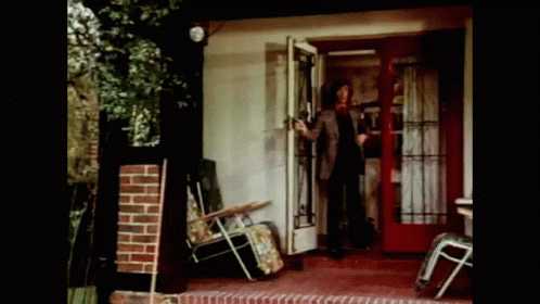 Man Standing in Front of Glass Door