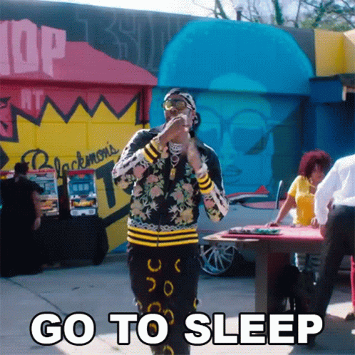 Man Standing in Front of Go to Sleep Building