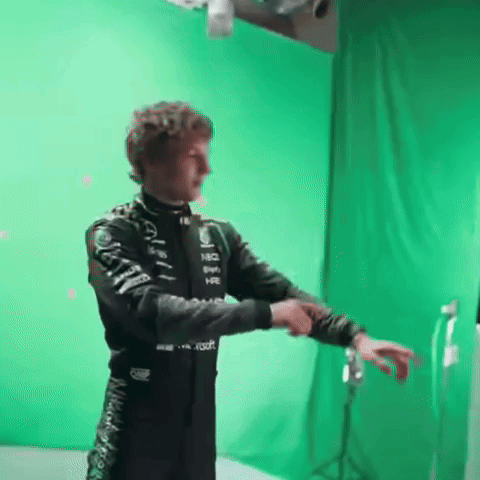 Man Standing in Front of Green Screen