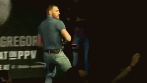 Man Standing In Front Of Gregor Sign GIF