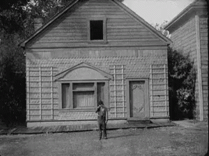 Man Standing In Front Of House GIF