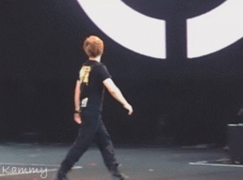 Man Standing In Front Of Kammy Drum Set GIF