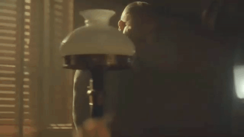 Man Standing In Front Of Lamp GIF