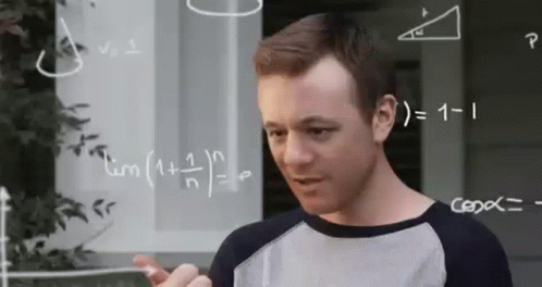 Man Standing in Front of Math Whiteboard