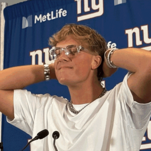Man Standing in Front of MetLife Sign