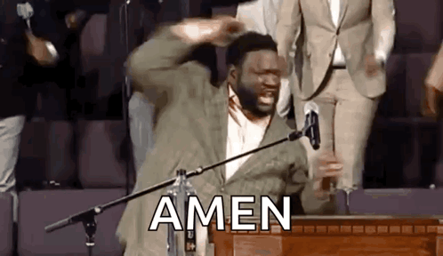 Man Standing in Front of Microphone with Amen