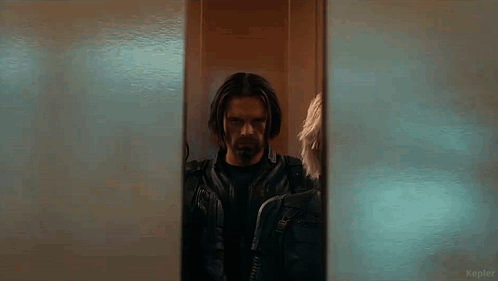 Man Standing in Front of Mirror