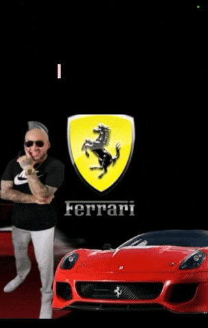 Man Standing in Front of Red Ferrari