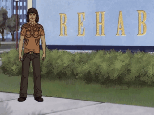 Man Standing in Front of Rehab Building