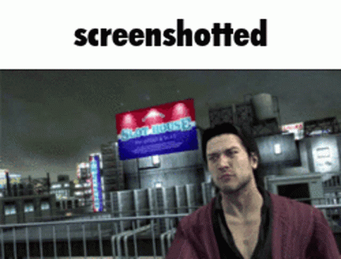 Man Standing in Front of Screenshotted Sign