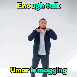 Man Standing in Front of Sign Saying Enough Talk