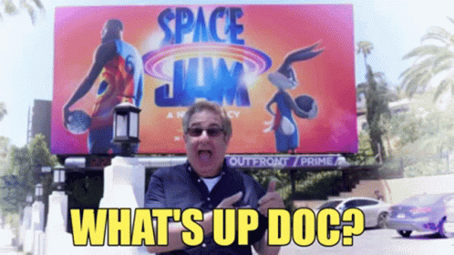 Man Standing in Front of Space Jam Billboard