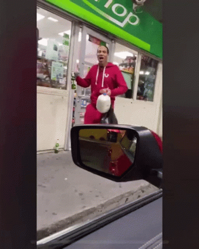 Man Standing In Front Of Store With Top GIF
