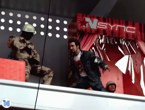Man Standing In Front Of Sync Sign GIF