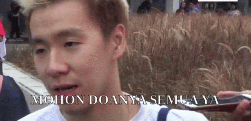 Man Standing In Front Of Tall Grass GIF