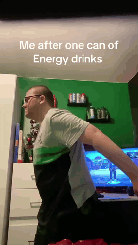 Man Standing in Front of TV Me After One Can of Energy Drinks