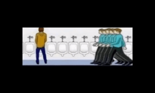 Man Standing in Front of Urinal