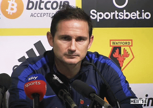Man Standing In Front Of Watford Sign GIF