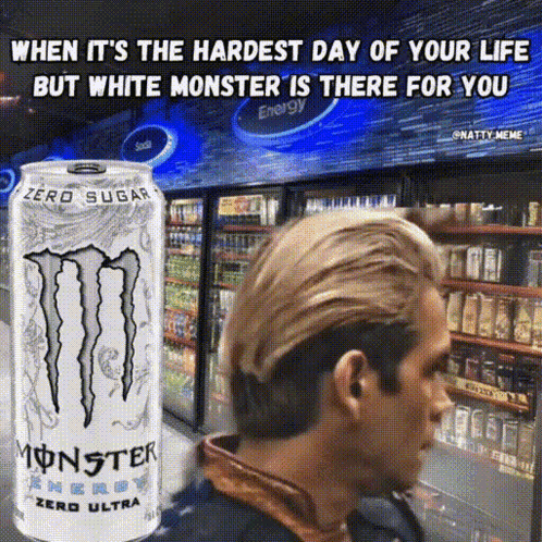Man Standing in Front of White Monster Energy Drink