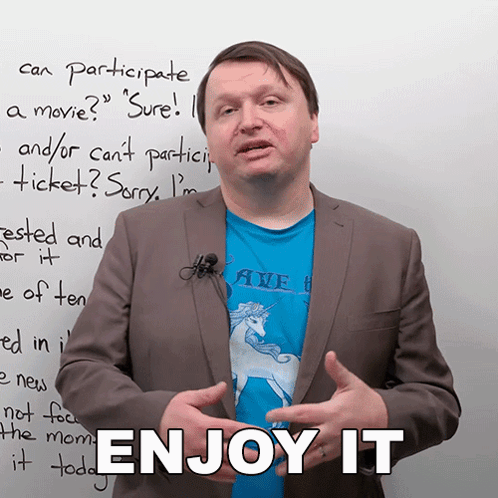 Man Standing in Front of Whiteboard Saying Enjoy It