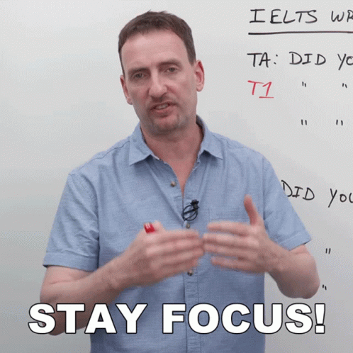 Man Standing in Front of Whiteboard Saying Stay Focus