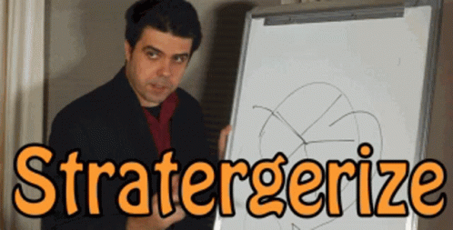 Man Standing in Front of Whiteboard Saying Stratergerize